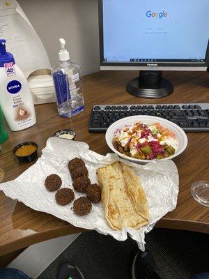 Shawarma bowl with falafel and pita.