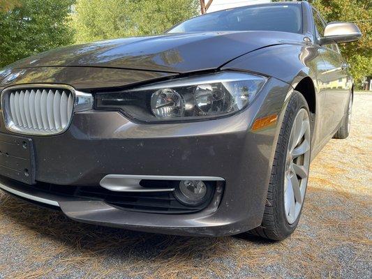 Poorly repaired and scratched front bumper. Hood bent and misaligned.