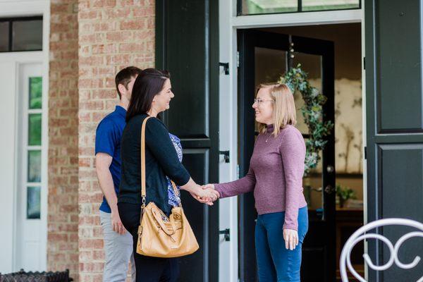 Elizabeth Polinsky LCSW greeting a couple outside of her office. For more information, see www.ElizabethPolinskyLCSW.com