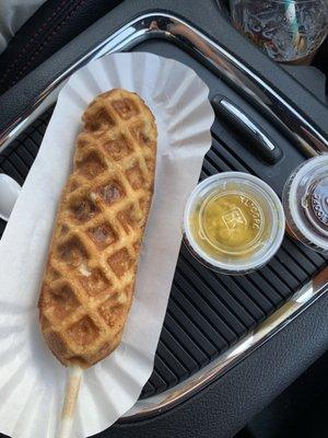 Waffle dog with a side of mustard and maple syrup