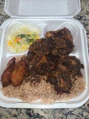 Oxtails, rice & peas, cabbage medley and plantains