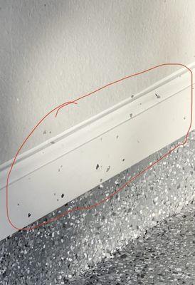 Splashes of oerma-flex all over our newly painted garage baseboards