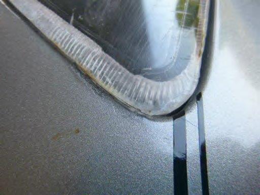 Damage on opposite fender and headlight