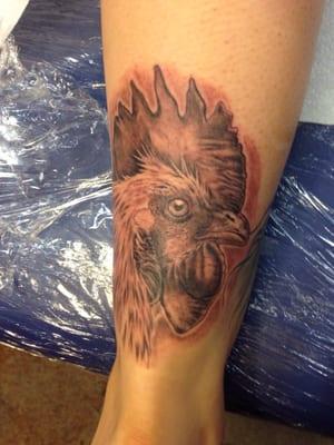 Black and grey tattoo rooster on the achilles