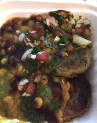 Ragda Pattice with a tasty peas curry and garnished with tangy sauces and chutney.