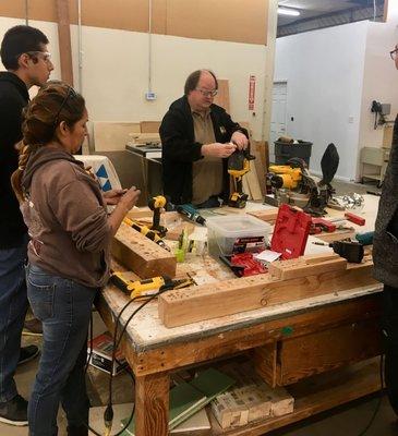 Image from our construction program.  Students getting hands on training with power tools.