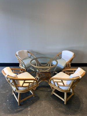 Rattan Chat Set with upholstered swivel seats and glass table top.