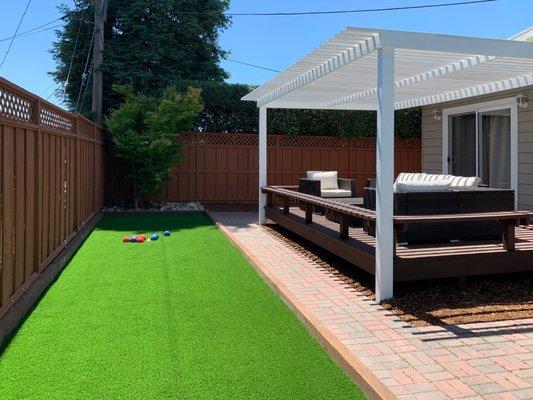 Turf, bocce, pergola, deck, pavers, fence