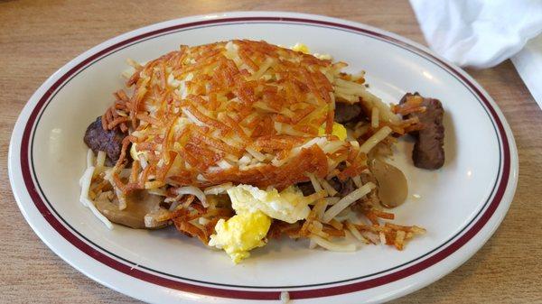 Prime rib tips with scramble eggs mushroom and hash browns