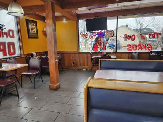 Papers on tabletops, trash on floor, and tabletops that haven't been wiped since the last 2 or 3 people ate there.