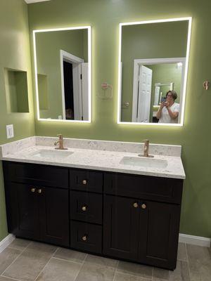 Love these LED Lit Medicine Cabinets Zsuzsanna helped me select and the Delta Champagne Bronze faucets