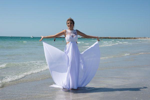 This Clearwater Beach bride's gown can be held w/ little loops on the sides - to give the fun dress wings. Our bride had a blast posing w/it