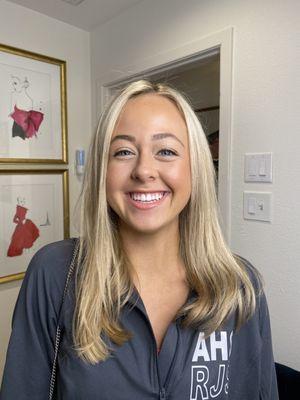 Natural makeup application for graduation photos.