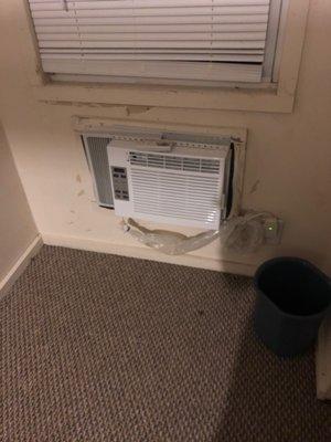 A/c looks like it ready to fall out the wall