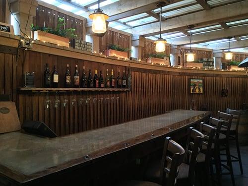 Enclosed patio; back wall constructed of wine barrel strakes.