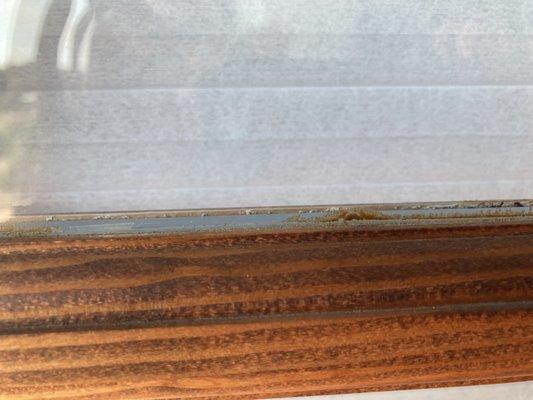 Part of glue part of stain because it was not stained before the window panes were put in