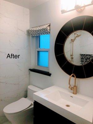 After: New floating vanity, toilet with concealed trapway, and mirror