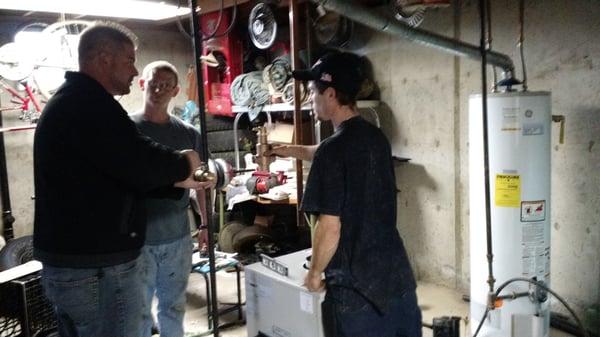 Adrian, Mitch, and Dylan on a new boiler installation.