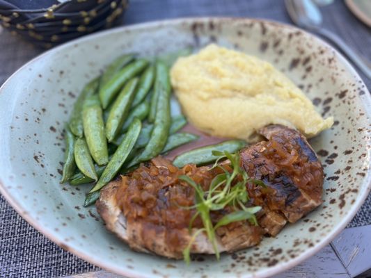 Pork tenderloin paired with fresh snap peas, and mashed sweet potato with a special house sauce. DELICIOUS