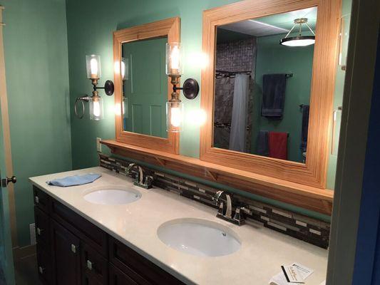 We had custom mirrors made from reclaimed wood. They are fantastic. We love the grain and finish.