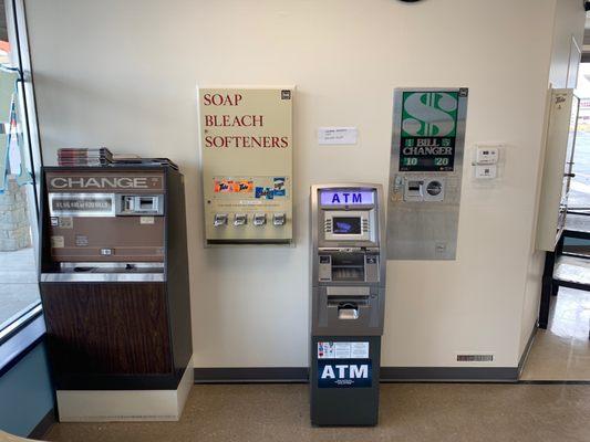 Two coin machines, ATM, and soap vending machine