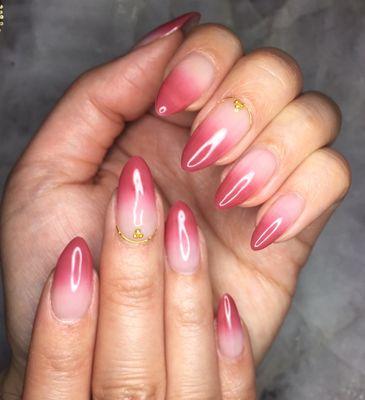 Ombré nails with delicate gold details.