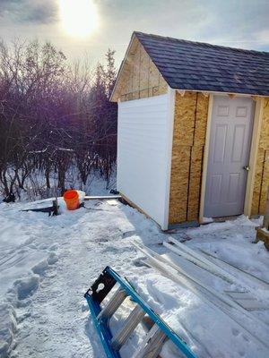 This is a work in progress. It is a 10x8 ft wooden shed built from the ground up.