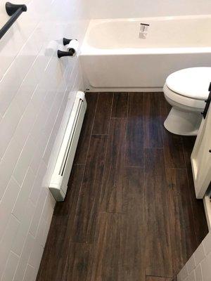 Tile floor with floor board heat