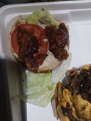 That's not a bacon cheeseburger. It's a burger they dropped a small piece of left over bacon on.