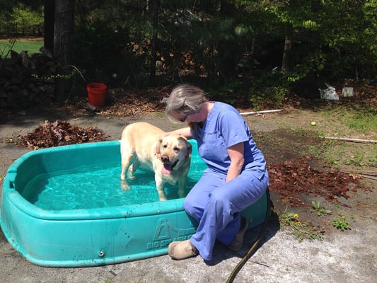 Dr Kim visiting a patient in his pool before their appointment