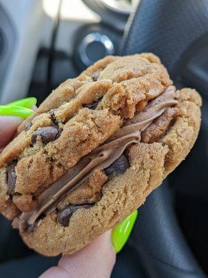 Chocolate chip cookie and peanut butter cream sandwich