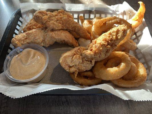 Chicken strip basket with onion rings and Cajun ranch dipping sauce!