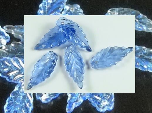 Ethereal vintage glass leaf bead in an unusual design.