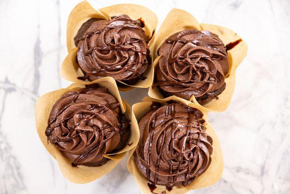 Mocha Cupcake: Chocolate cupcake with chocolate ganache layer and topped with chocolate mocha buttercream with a chocolate drizzle.