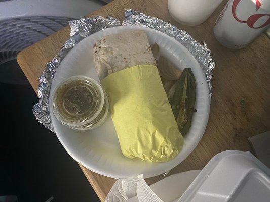 Asada burrito and some amazing sides! Jalapeños and grilled onions on the right, green sauce on the left.