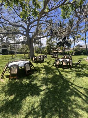 Brown padded chairs and round tables.