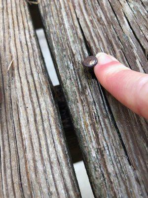 lifted nails riddled along the deck