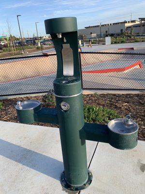 One of the on-site water fountains with the skate park in the background.