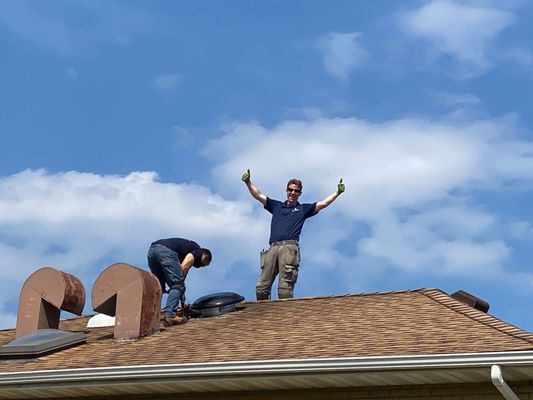 On the job! Roof attic fan installation.