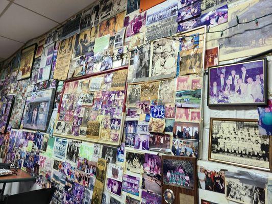 The walls are covered with old photos of family and friends.