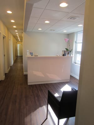 Waiting room and reception desk at EMH Physical Therapy