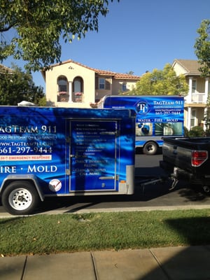 VIEW OF WORK TRUCKS ON LOCATION. WE'LL TAKE YOU FROM TRAGIC AND RESTORE YOUR HOME LIKE MAGIC!!