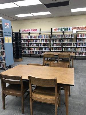 Fiction shelves to the left including large print, and all new selections to the right