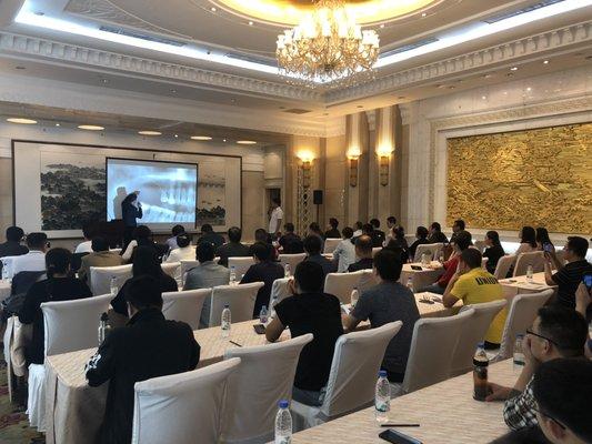 Dr Samuel Lee lecturing worldwide to dentist