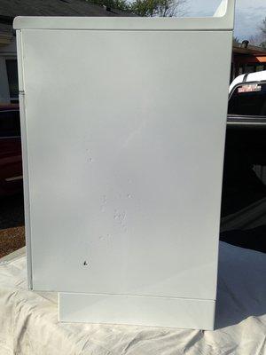 right side of cabinet damaged from sandblasting done by Nashville Powder Coating