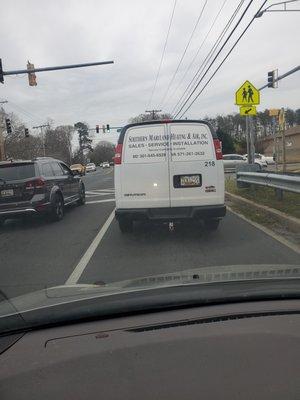 Friday March 31st at 5:02 pm lusby Driver of the work van cutting people off and was driving completely out of control.