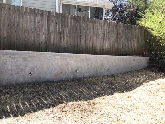 Shotcrete applied retaining wall