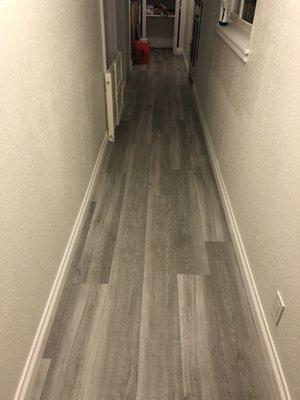 Life proof vinyl floor installation as well as baseboards.