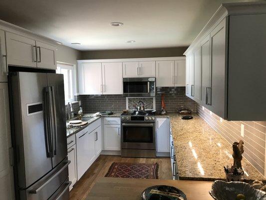 Kitchen remodel included wood floors, repurposed cabinets, new granite tops and all new appliances