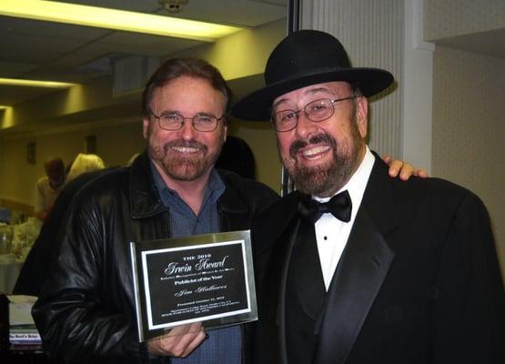 Jim Hallowes receiving the 2010 "Publicist of the Year" Award from radio icon "Shotgun Tom" Kelly.